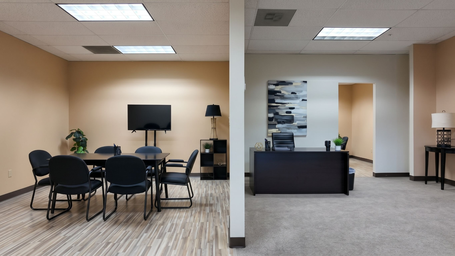 Front entrance of Suite 350 showing the reception desk and meeting room